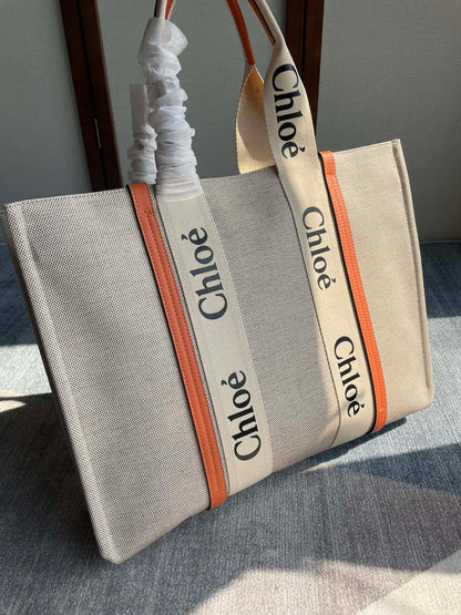 LAGRE WOODY TOTE BAG 45 IN BEIGE LINEN CANVAS BLACK WEBBING LOGO EMBROIDER ORANGE CALFSKIN