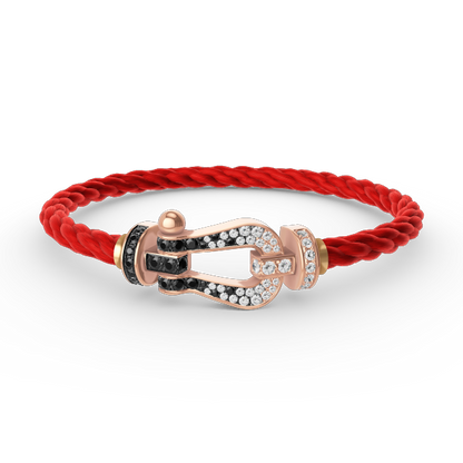 [AURORA]FORCE GROSSES HUFEISENARMBAND MIT SCHWARZ-WEISSEN DIAMANTEN UND ROSÉGOLD