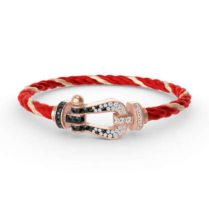 [AURORA]FORCE GROSSES HUFEISENARMBAND MIT SCHWARZ-WEISSEN DIAMANTEN UND ROSÉGOLD