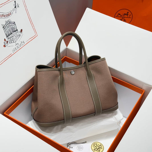 GARDEN PARTY 30CM IN BROWN TOILETS COTTON CANVAS AND TOGO ETOUPE CALFSKIN